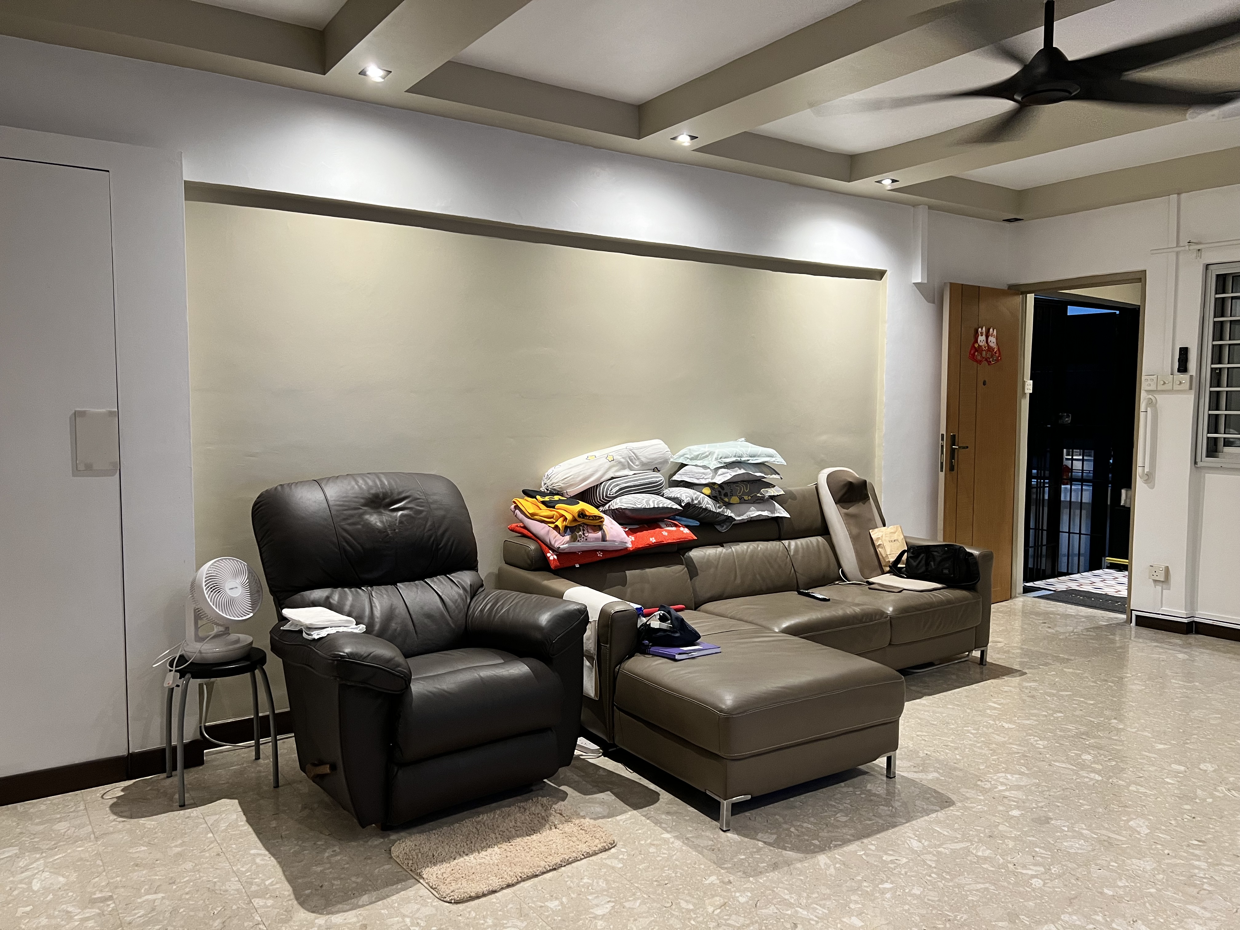 Before: living room with furniture and clutter